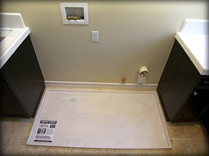 Coloring also allows dual washer and dryer pan to blend in with surrounding