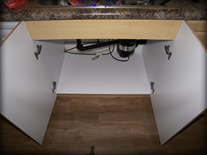 Cabinet without Slide N' Fit protector pan vulnerable to damage